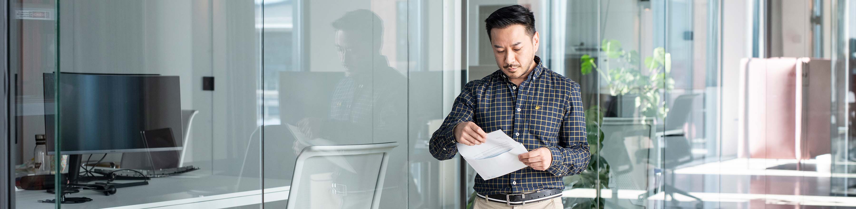 Man reads letter from envelop